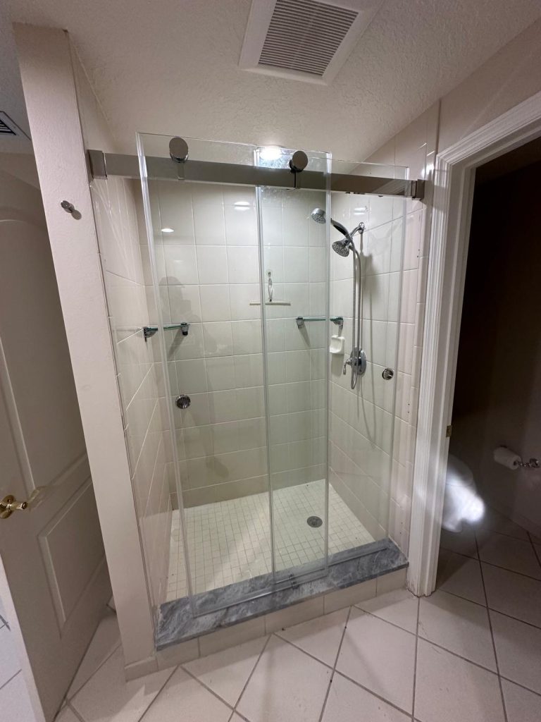 Sliding custom cut glass shower door